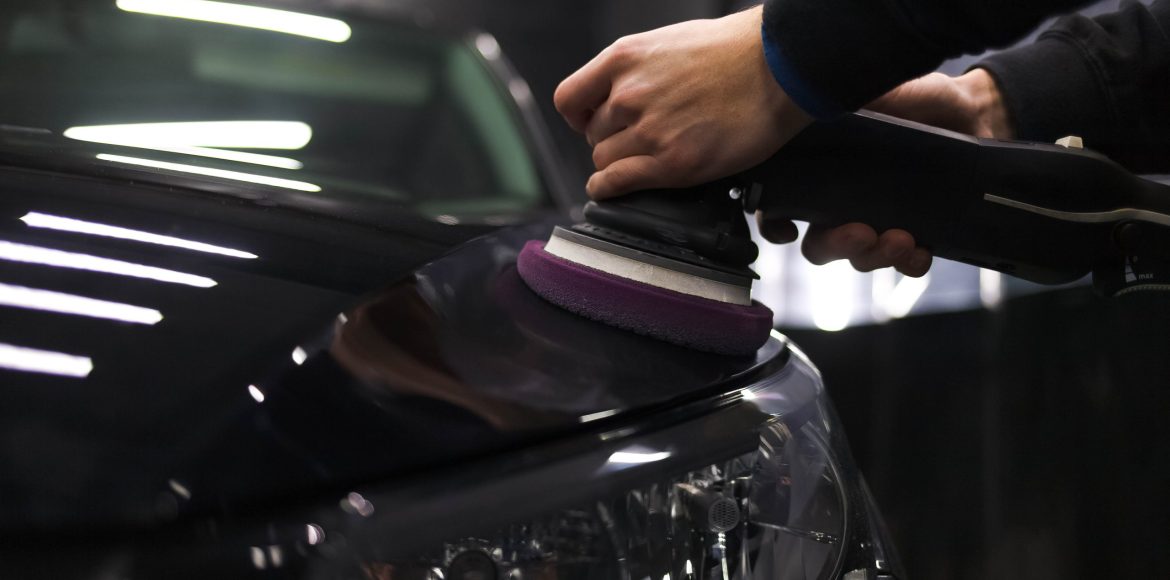 worker-polishes-car-s-paintwork-with-car