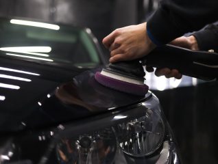 worker-polishes-car-s-paintwork-with-car